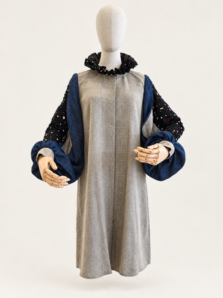 Front view of the Soulful taupe-grey linen top with deep blue layered sleeves and an embellished black ruffle collar.
